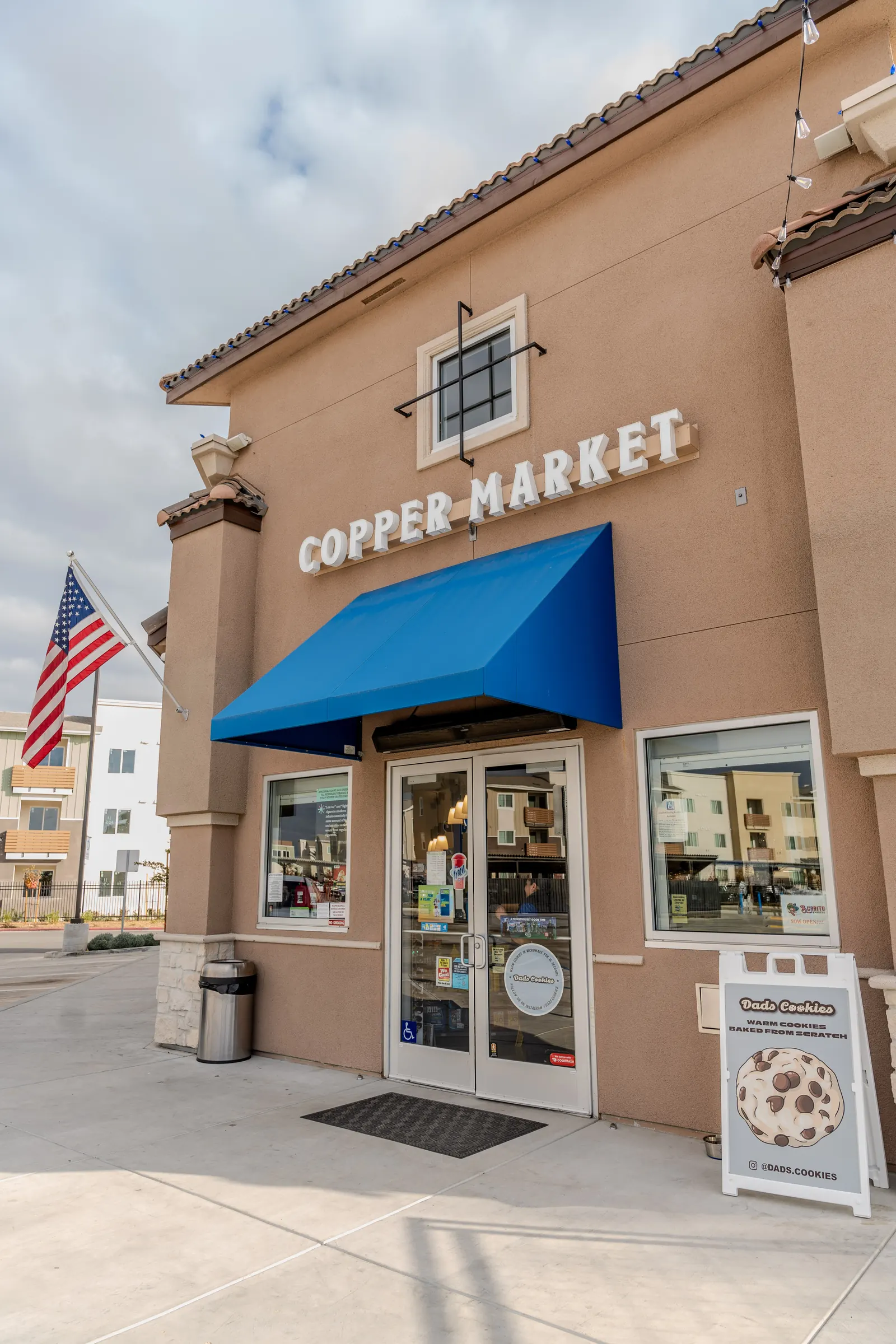 Copper Market channel letters above a storefront awning