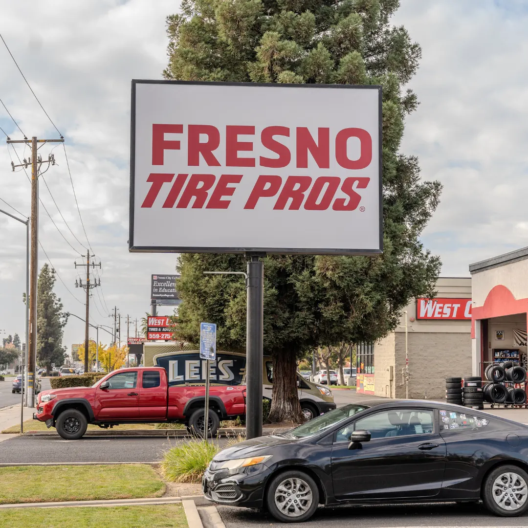 Fresno Tire Pros pylon sign by the road