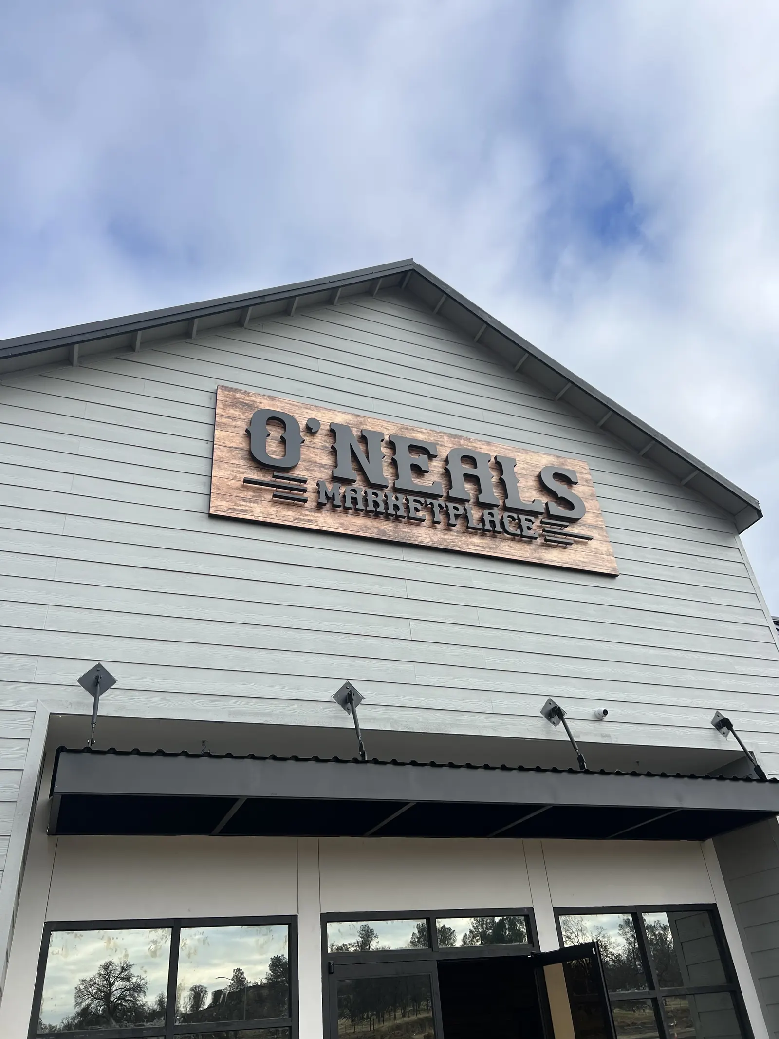Dimensional O’Neals pan sign on a building gable
